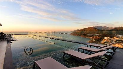 Swimming on infinity pool to see sunrise